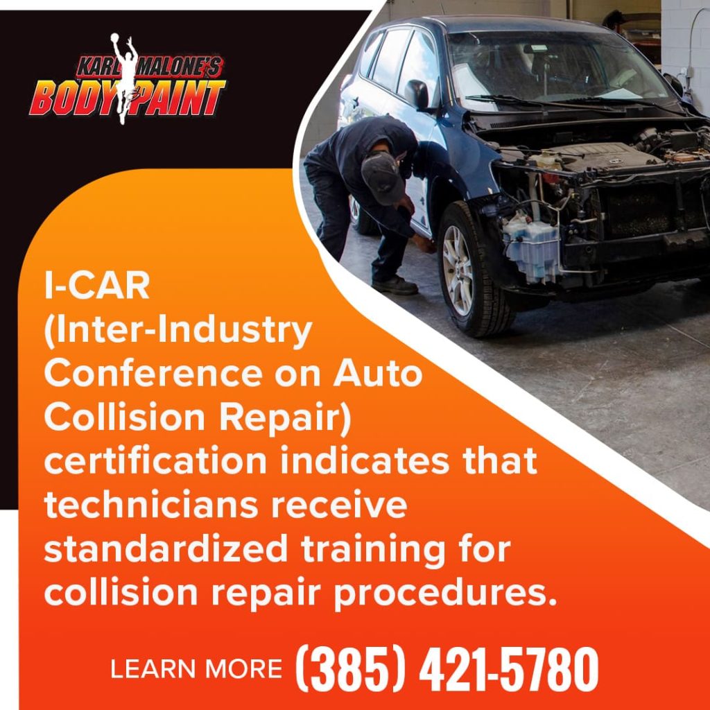 A Karl Malone's Body & Paint technician performing a repair on the front of a blue SUV, demonstrating I-CAR certified collision repair procedures.