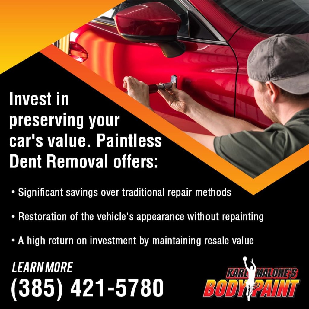 A technician uses a specialized tool for paintless dent removal, a process that restores a car's appearance and maintains its resale value.
