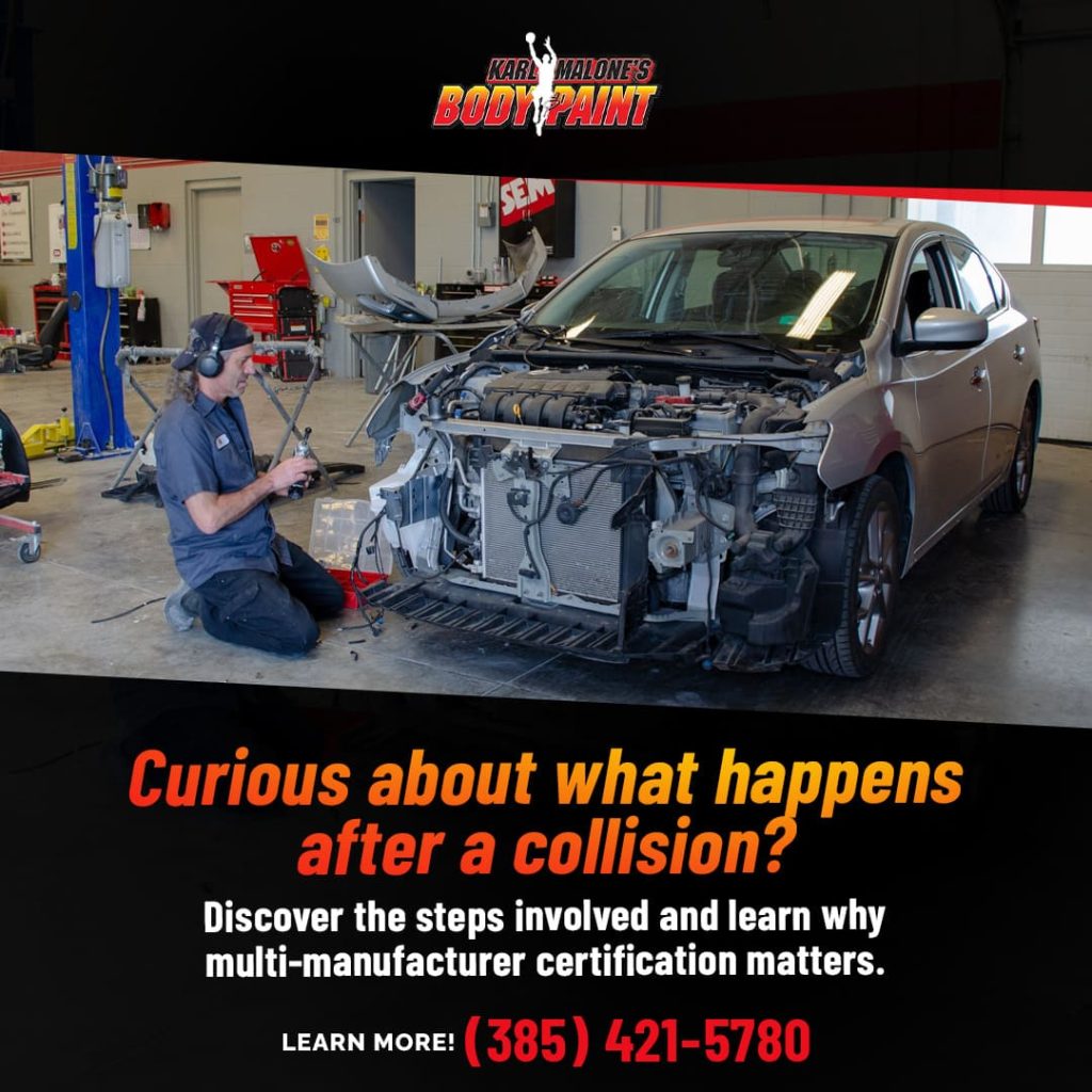 Collision repair specialist working on the engine bay of a heavily damaged car, highlighting the repair process and need for multi-manufacturer certification in Draper, UT.