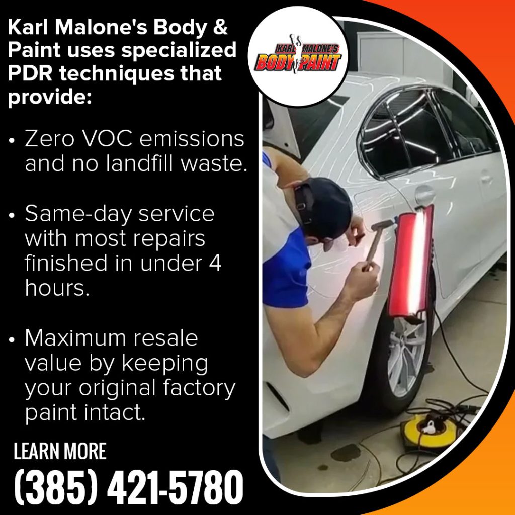 Technician using paintless dent repair tools to remove a dent from a white car at Karl Malone’s Body & Paint in Draper, Utah